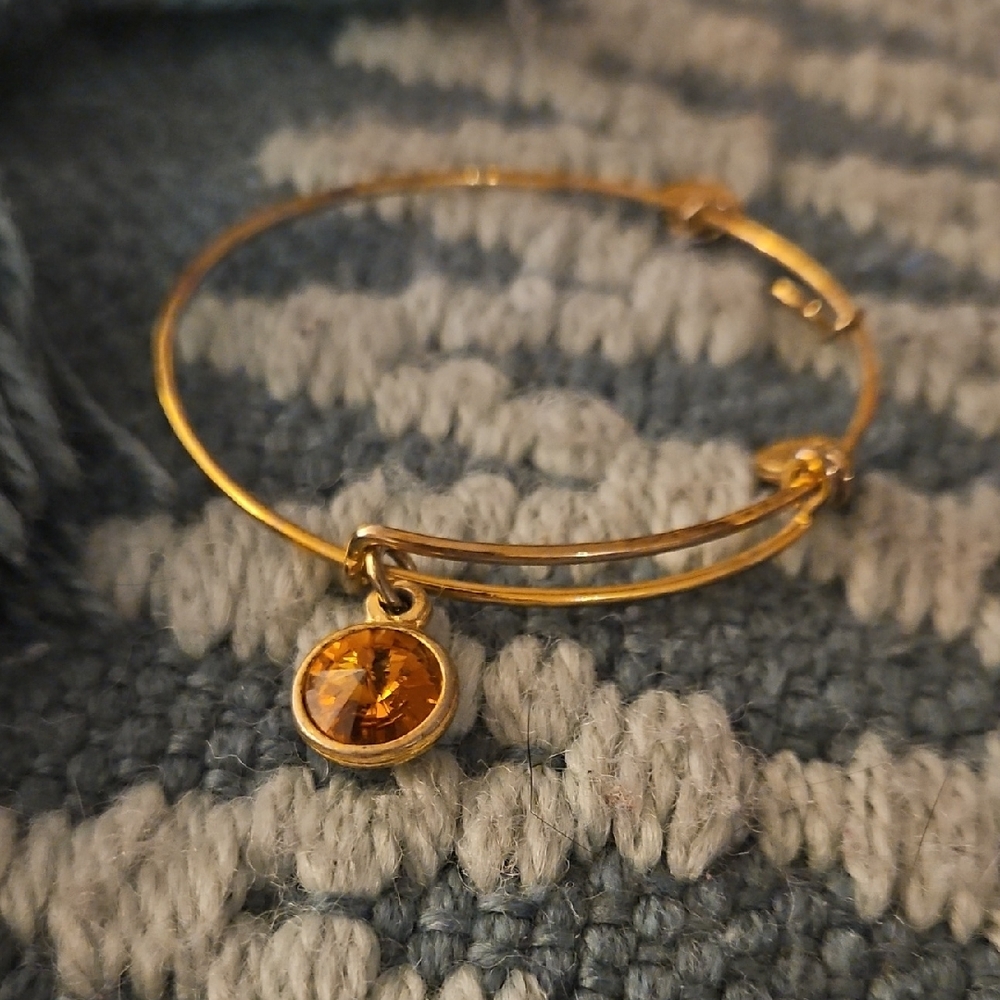 Elegant Gold Bangle with Amber Charm